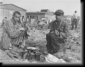 Following the liberation, prisoners prepare food in the Dachau camp * 377 x 296 * (55KB)